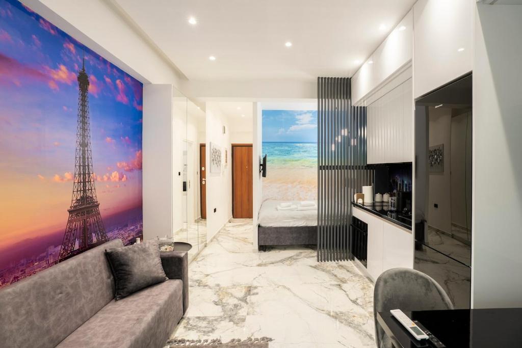 a living room with a large painting of the eiffel tower at Serenity Nook by Sefi in Mesochórion