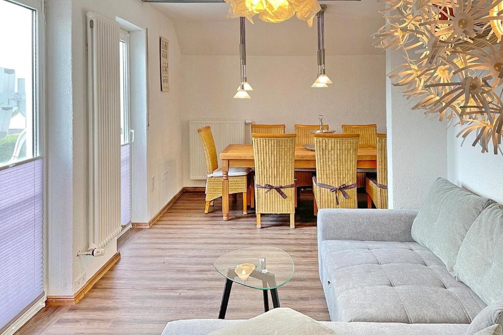 a living room with a couch and a table at Pusteblume in Lübbenau