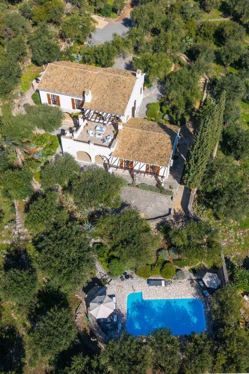 an aerial view of a house with a swimming pool at Spartilas Villas in Pyrgi