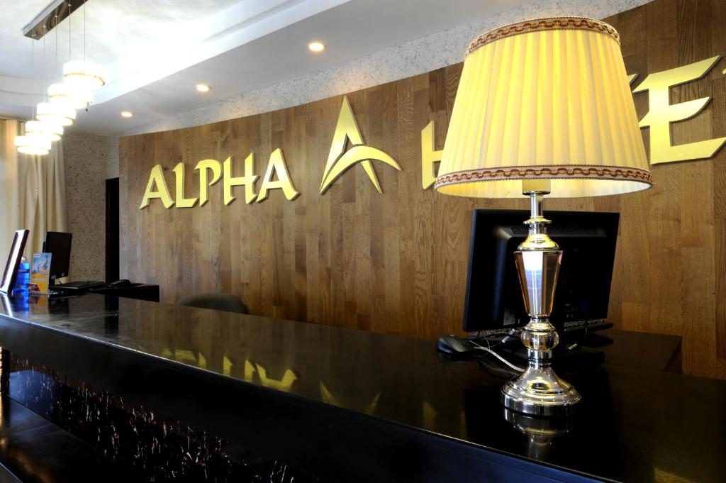 a lamp sitting on a bar in a restaurant at Alpha Hotel Ulaanbaatar in Ulaanbaatar