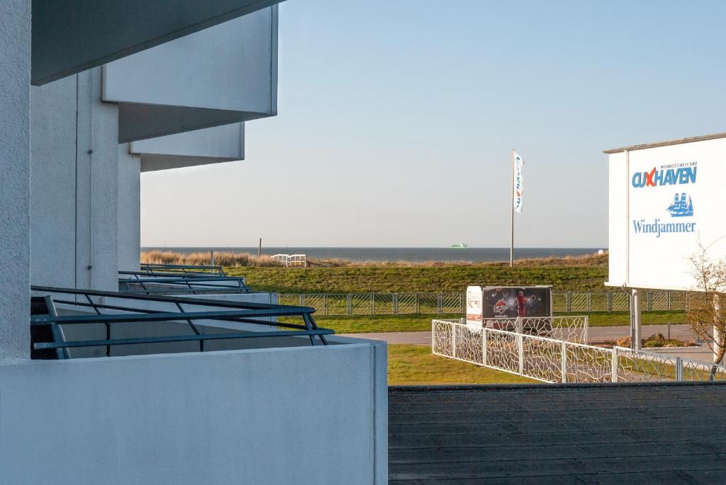 a group of bleachers with a sign and the ocean at Hanseatic 110 in Duhnen