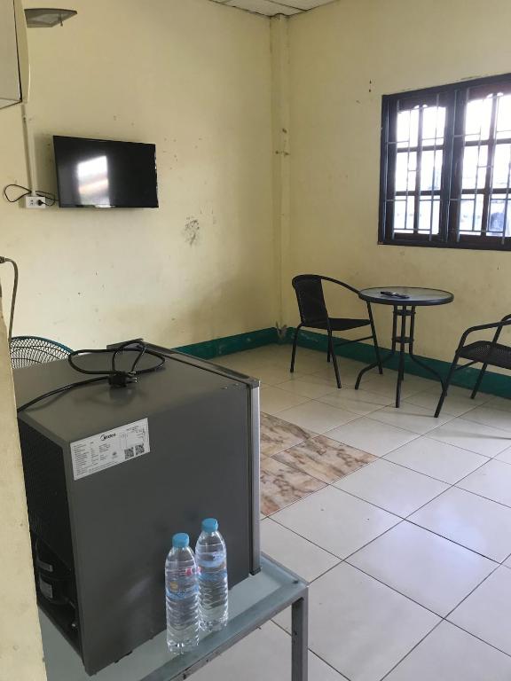 a room with two bottles of water on a table at Yada House in Nong Ki
