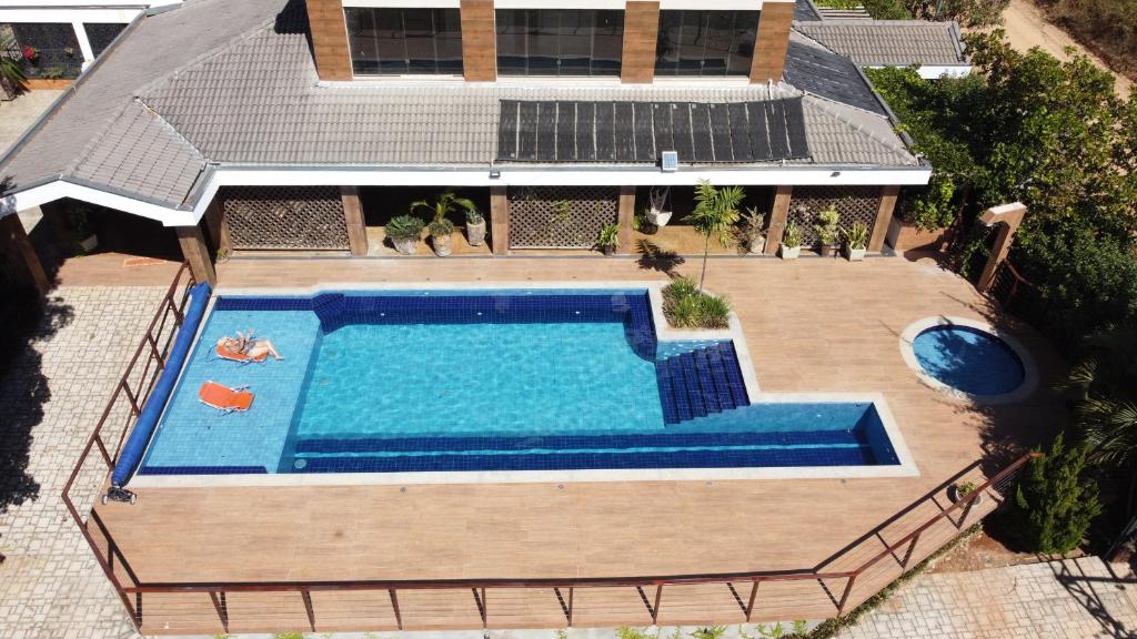 an overhead view of a swimming pool in front of a house at Pousada Real in Caldas Novas
