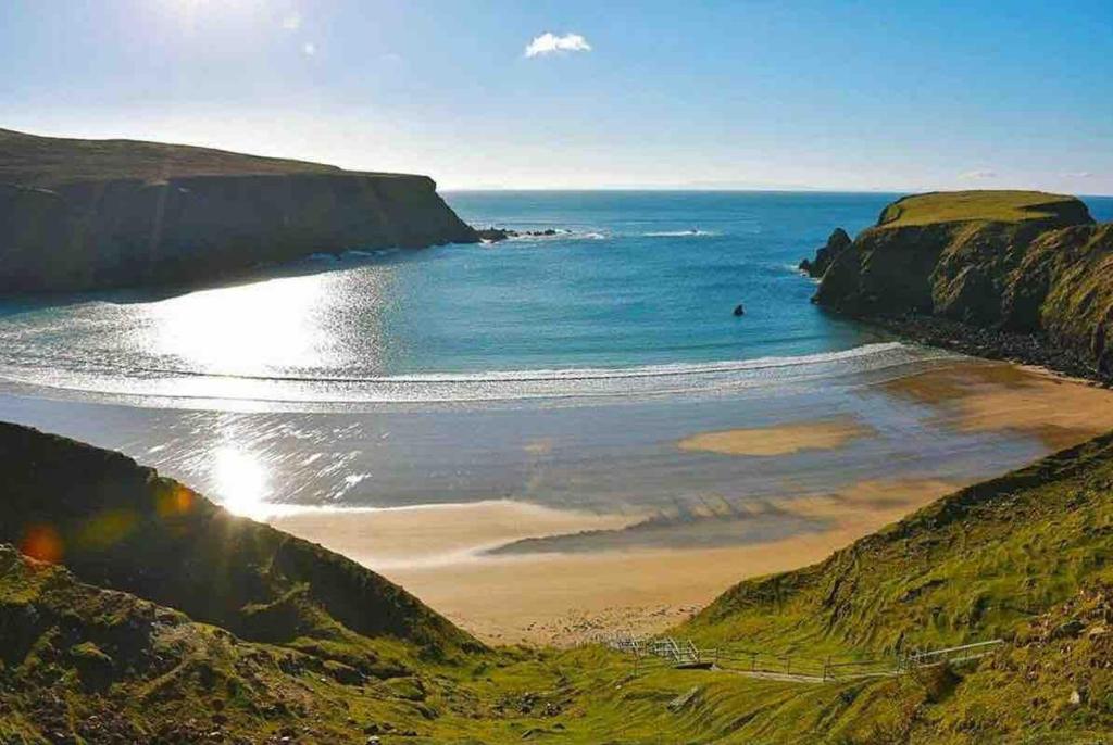 a view of a beach with the ocean at Silver Strand Chalets - Chalet 2 in Malin Beg