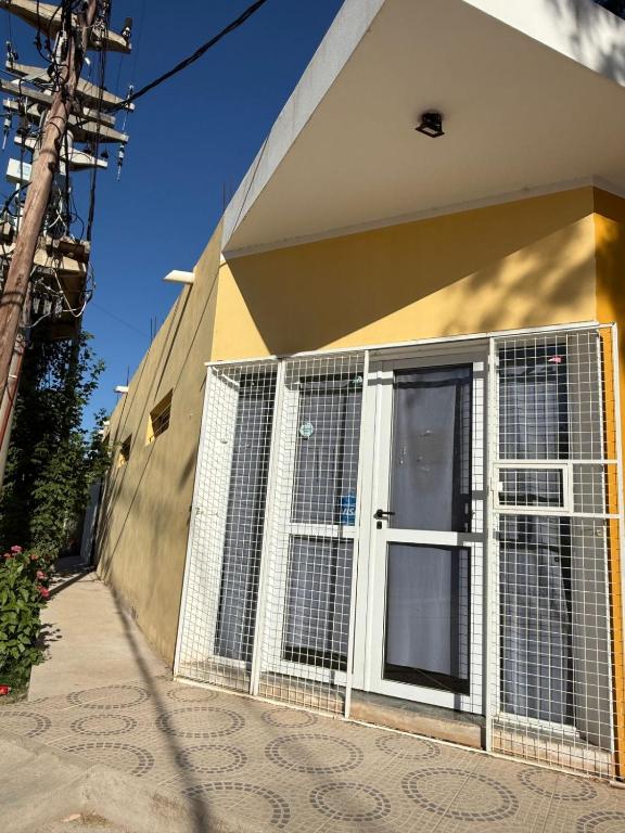 a front door of a house with a gate at Modo soto in Villa de Soto