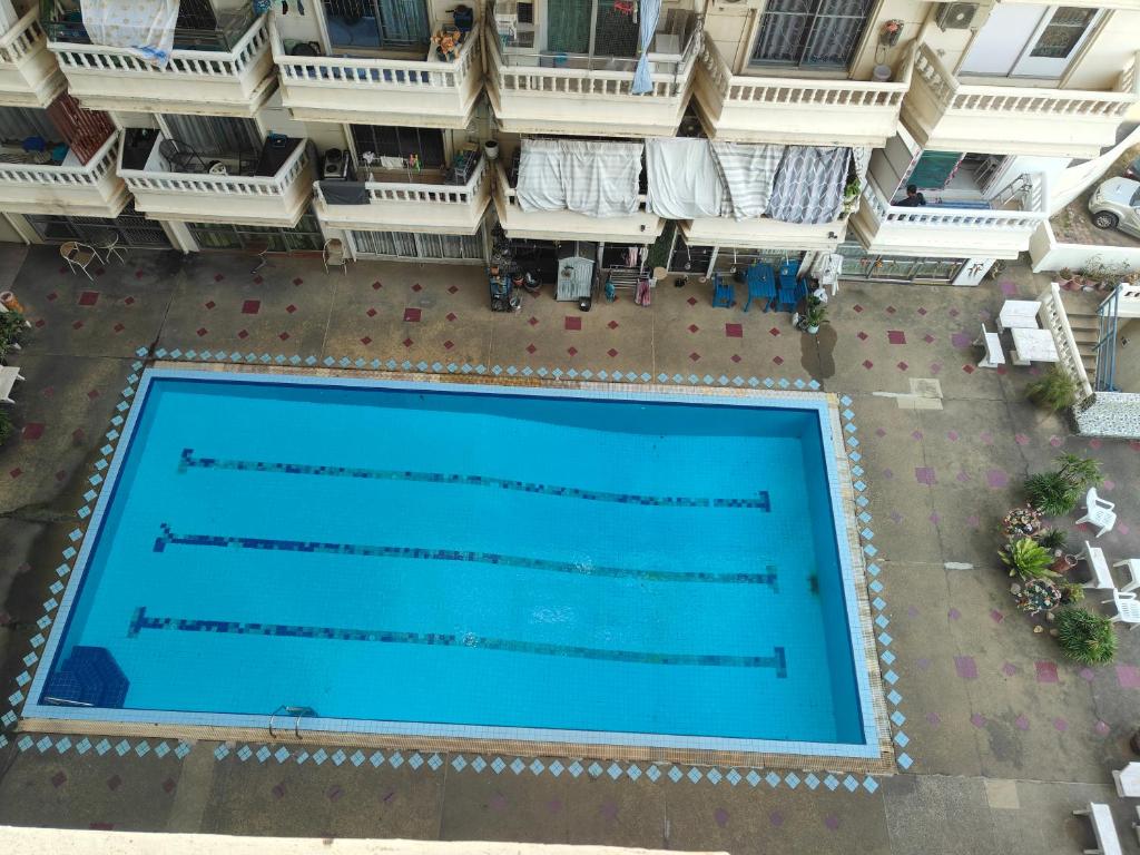 an overhead view of a swimming pool in a building at nirun condo 238 in Pattaya