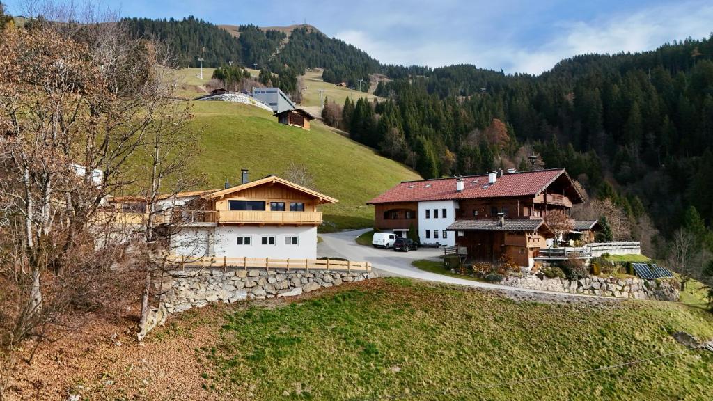 a group of houses on a hill with a road at Chalet Schernthann in Salvenberg