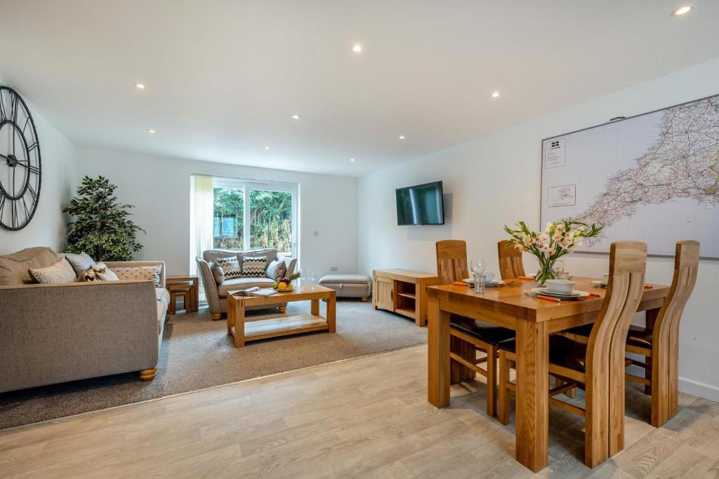 a living room with a table and a couch at 2 Bed in St. Issey oc-o27778 in Saint Issey