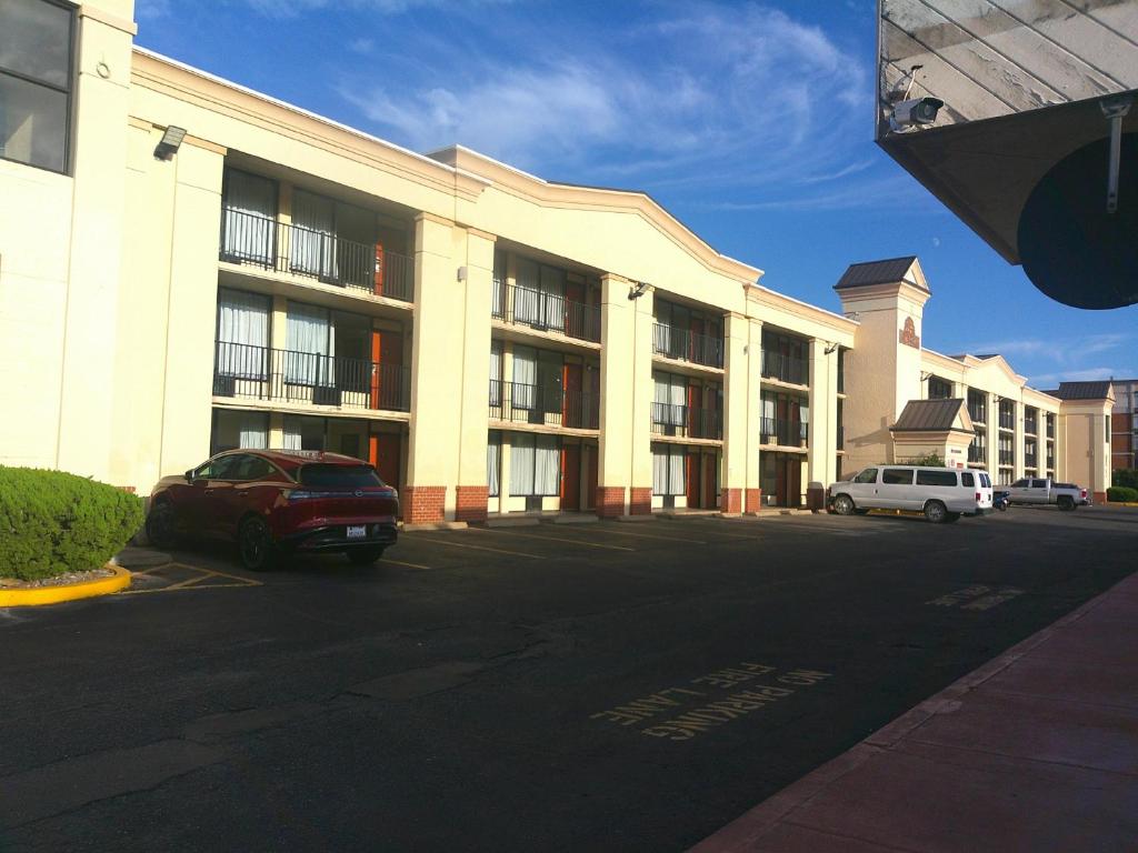 a parking lot in front of a large building at Red Roof Inn Hampton Coliseum in Hampton