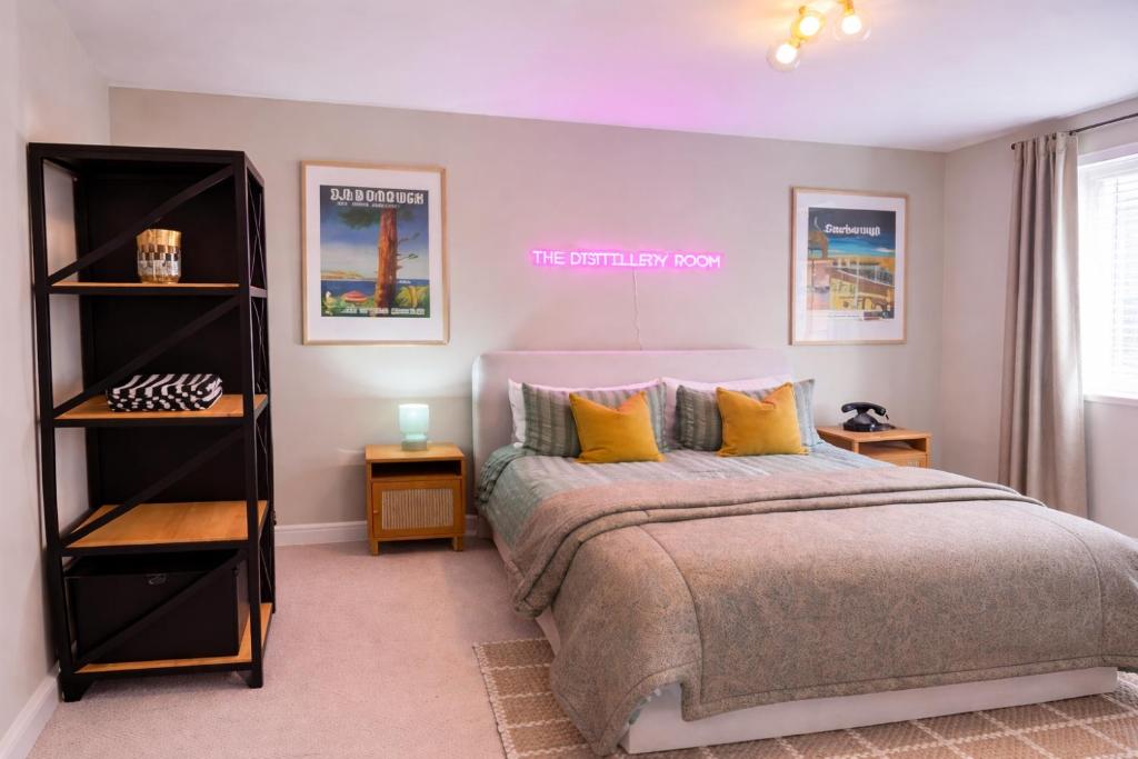 a bedroom with a bed with yellow pillows at The Distillery Room in Scarborough