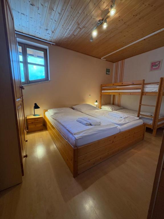 a bedroom with two bunk beds and a window at Panorama Apartments II in Lohberg