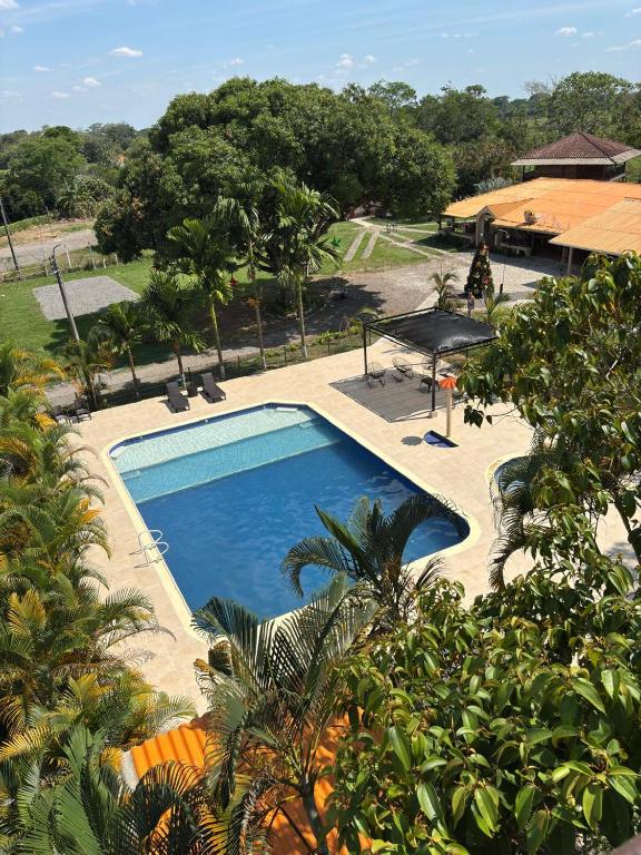 an overhead view of a swimming pool at a resort at Finca Hotel Buenos Aires in Guamal