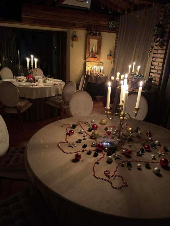 a dining room with a table with christmas decorations on it at CASA LUCA in Moldova Nouă