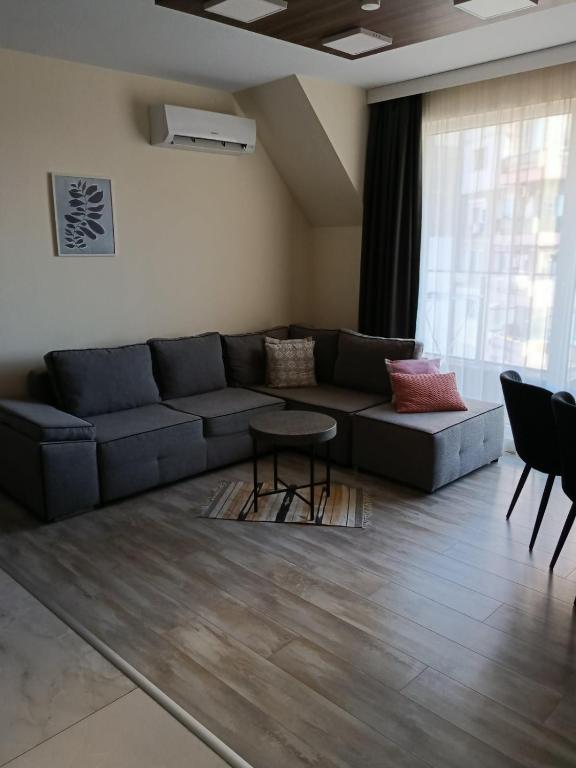 a living room with a couch and a table at AMAYA in Varna City