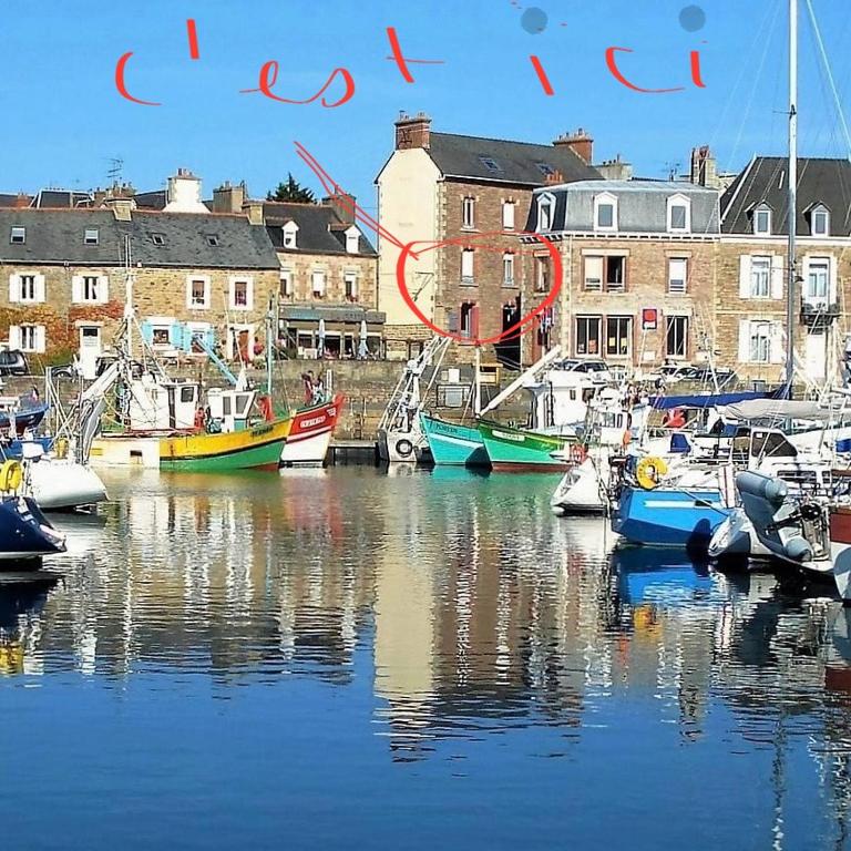 a group of boats are docked in a harbor at Morbreizh 1 in Paimpol