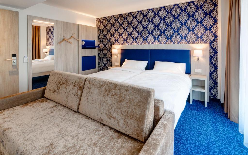Ein Bett oder Betten in einem Zimmer der Unterkunft ibis Styles Rastatt Baden-Baden