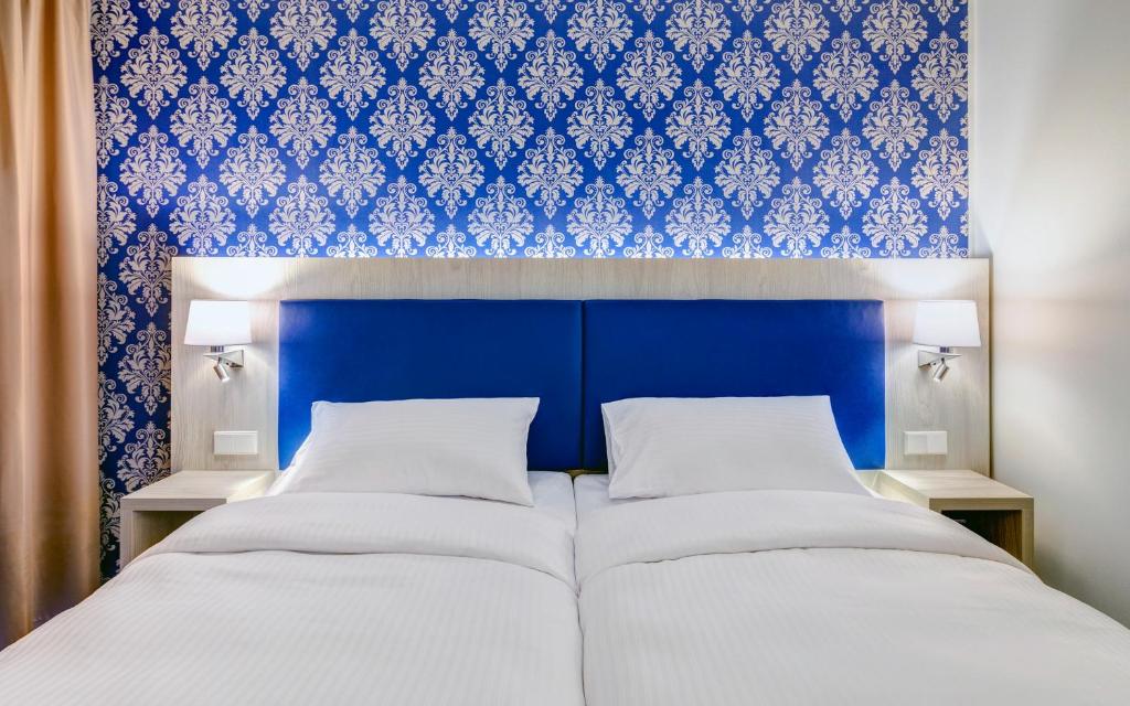 Ein Bett oder Betten in einem Zimmer der Unterkunft ibis Styles Rastatt Baden-Baden
