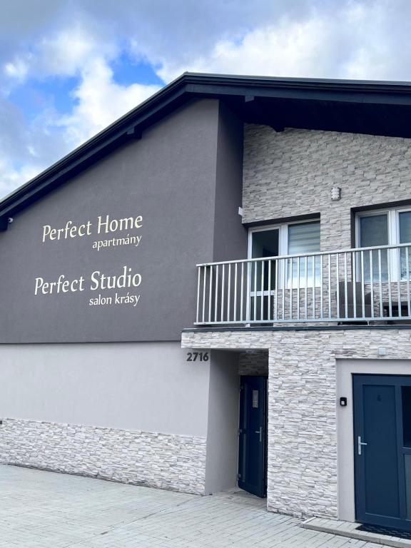 a building with the words perfect home communityperfect studio sdvisor at Apartmány Perfect Home in Česká Lípa
