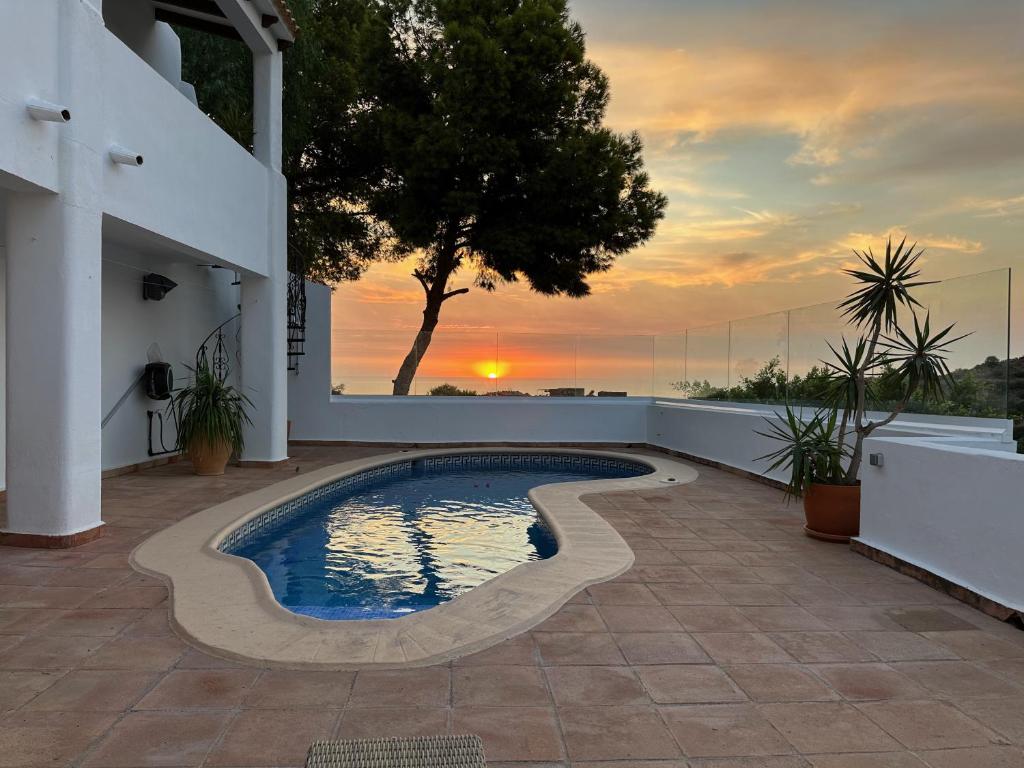 a swimming pool on the side of a house at ArteVida Andalusia FKK Nudist Holiday with yoga and massage in Mojácar