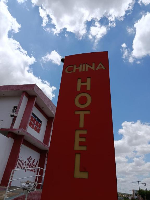 a red sign in front of a building at China Hotel in Canindé de São Francisco