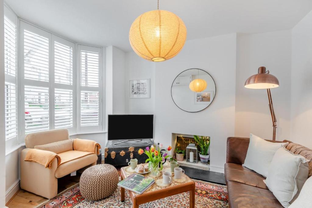 a living room with a couch and a fireplace at 2 Bed in Whitstable oc-w31887 in Whitstable