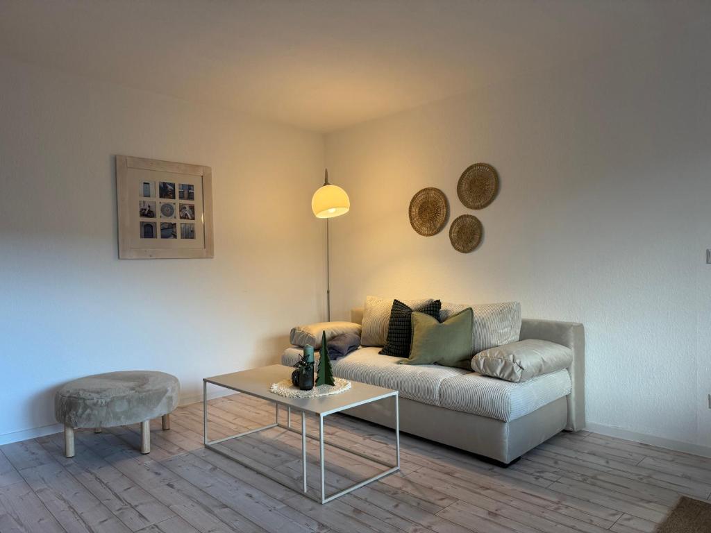 a living room with a couch and a table at Sweet Escape in Bad Pyrmont