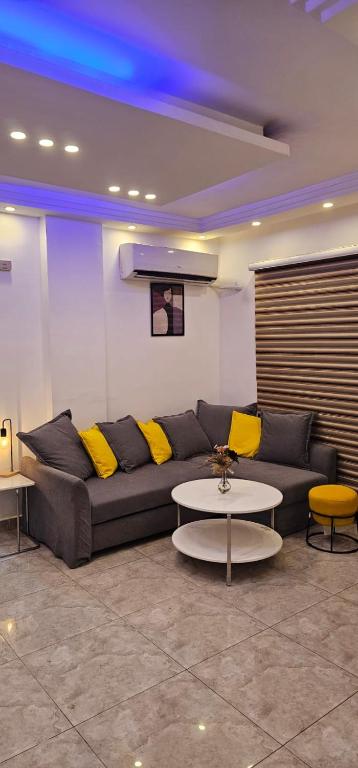 a living room with a couch and a table at 2 bedrooms apartment no 13 in Amman