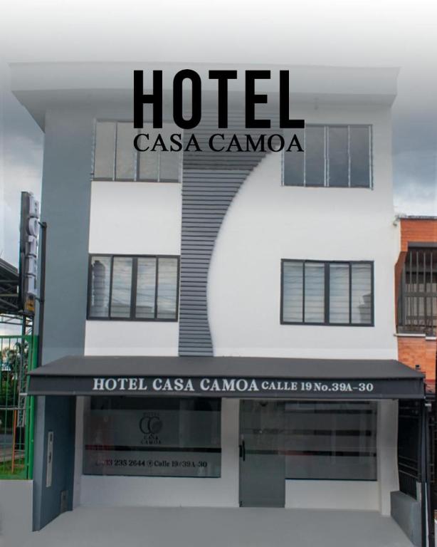 a hotel with a sign on the front of it at Hotel Casa Camoa in Villavicencio