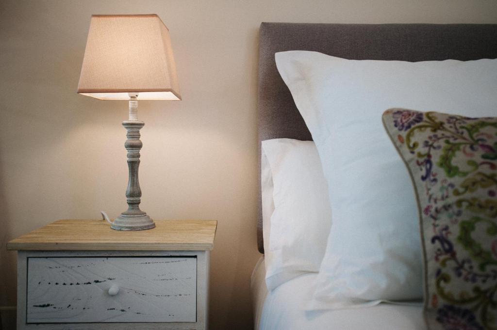 Łóżko lub łóżka w pokoju w obiekcie Hommyhome Pozo Santo Penthouse