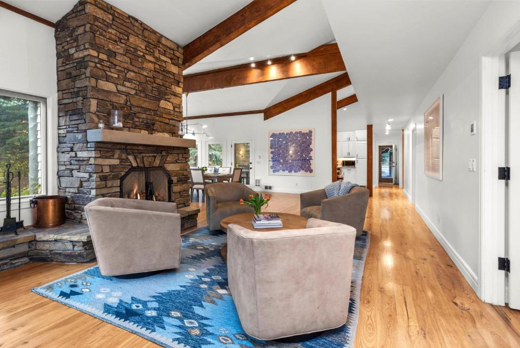 a living room with a couch and a fireplace at Abode at Alpine Retreat in Wilson