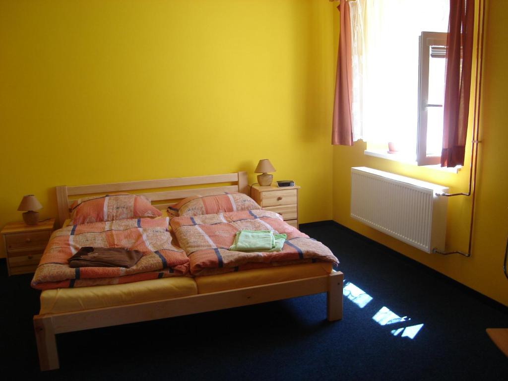 a bedroom with a bed and a window at Šenk u Švejka in Ústí nad Labem