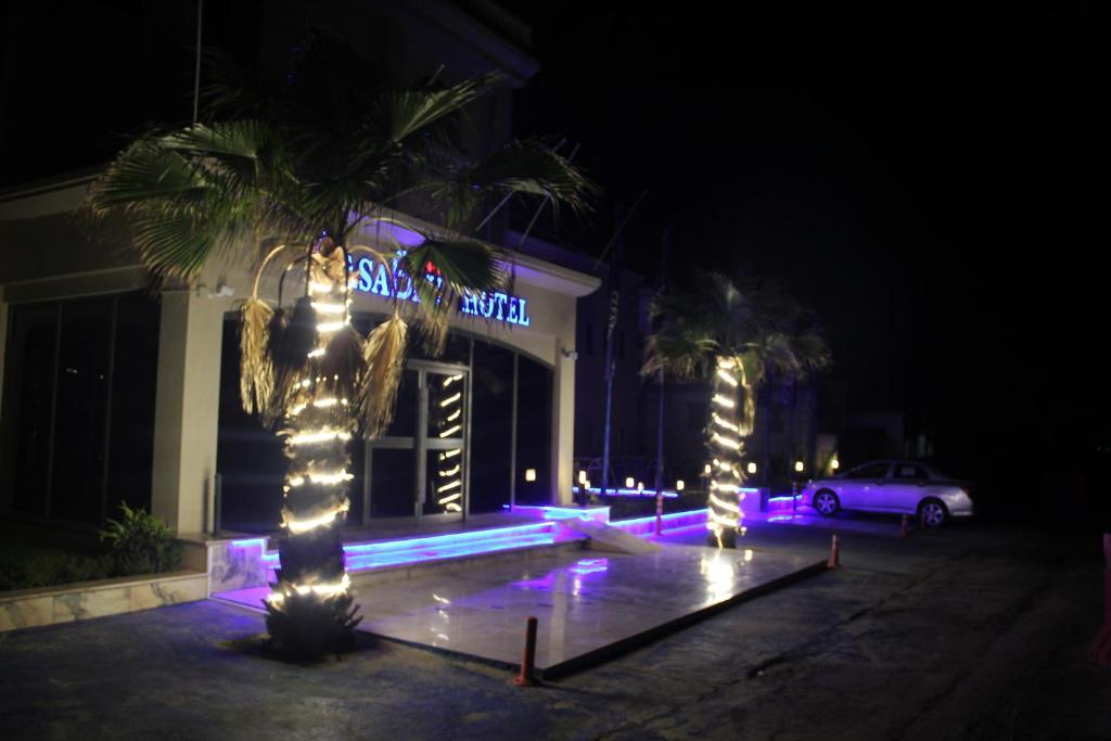 a building with lights in front of it at night at Casablu Hotel in Nouakchott