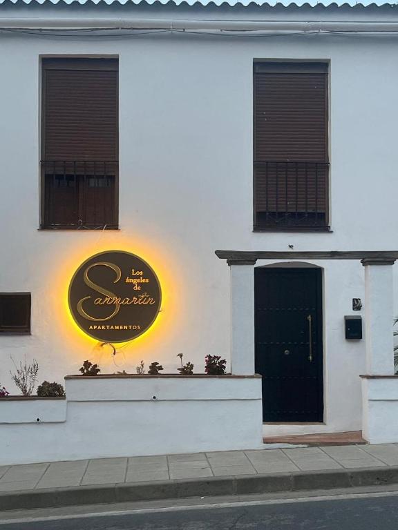 a building with a sign on the side of it at Los Ángeles de Sanmartín in Jimena de la Frontera