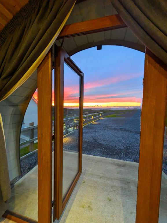 a view of the ocean from the window of a house at Sea Crest Pods Rossnowlagh Donegal in Rossnowlagh