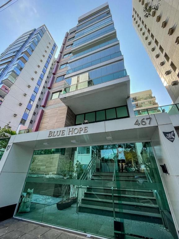 a building with a glass door and stairs in front at Blue Hope, 467, LUXO em Vitória ES in Vitória