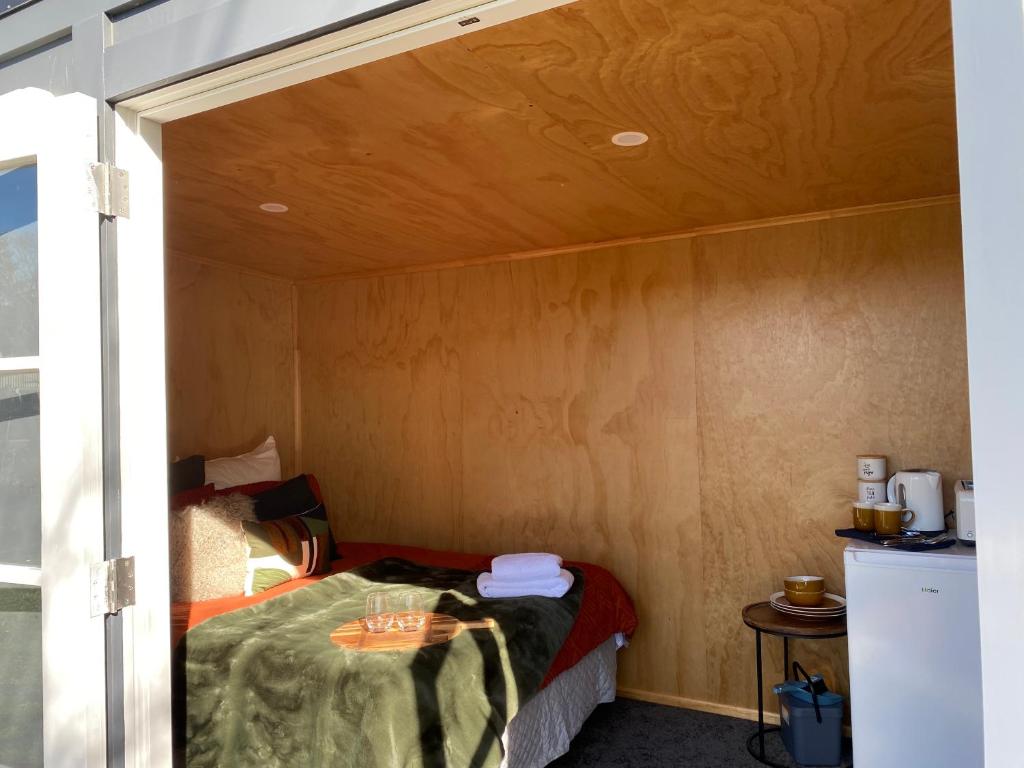 a room with a bed in a small room at Ruapehu Views Cabin Getaway in Raetihi
