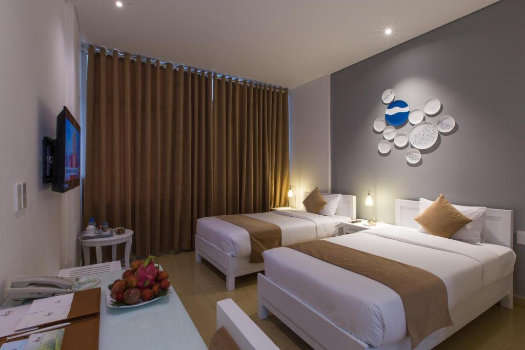 Llit o llits en una habitació de Alba Hotel