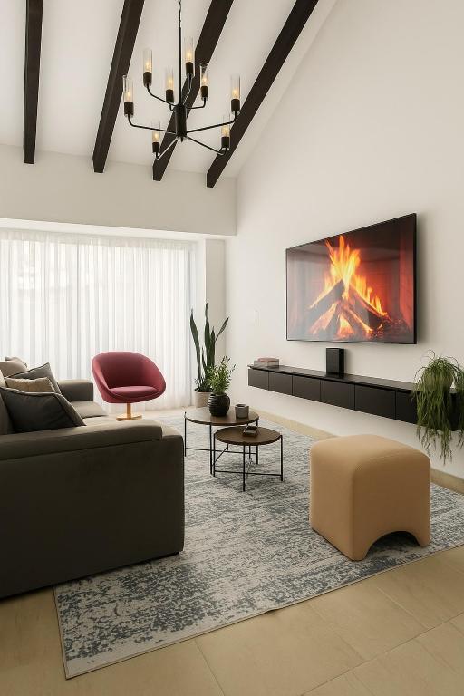 a living room with a couch and a fireplace at Casa G, en Rionegro in Rionegro
