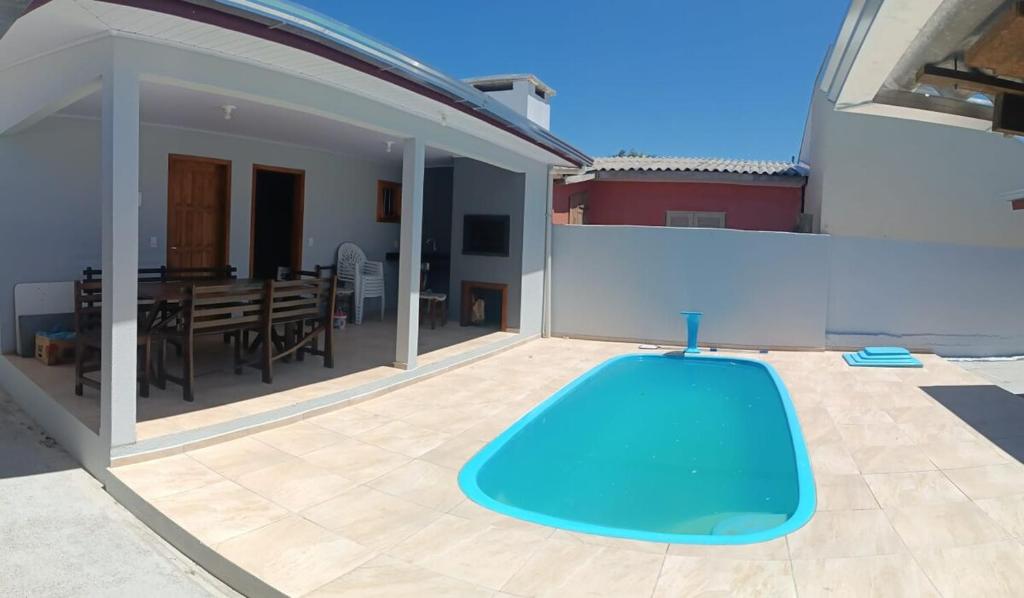 a swimming pool on the roof of a house at House with pool Arroio do Sal in Arroio do Sal