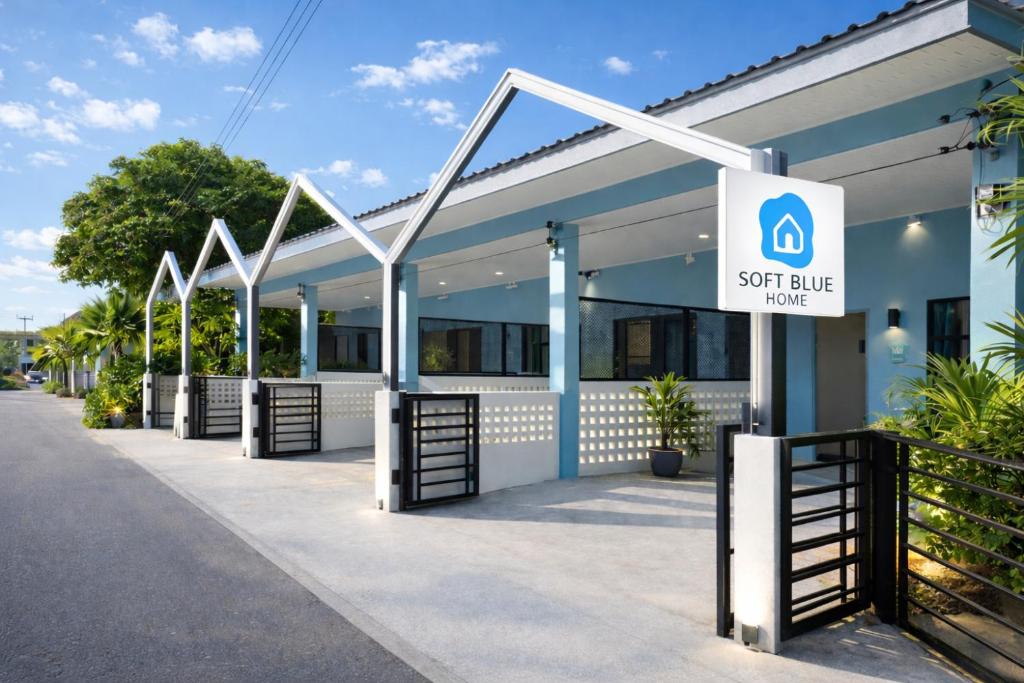 a building with a sign that reads exit rule house at Soft Blue Home, Krabi Town in Krabi
