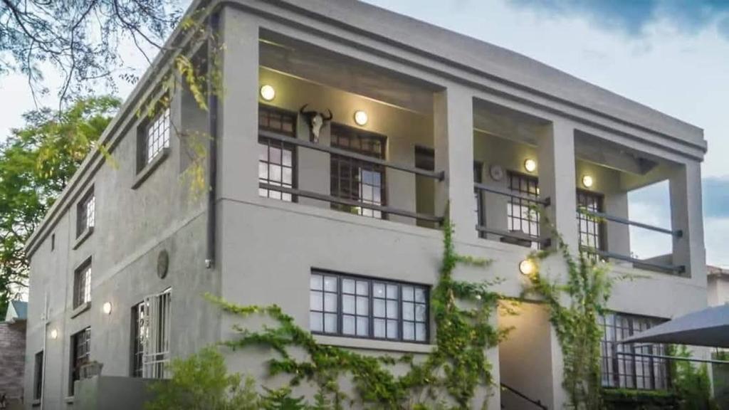 a large white building with windows on the side of it at Muckleneuk Manor in Pretoria