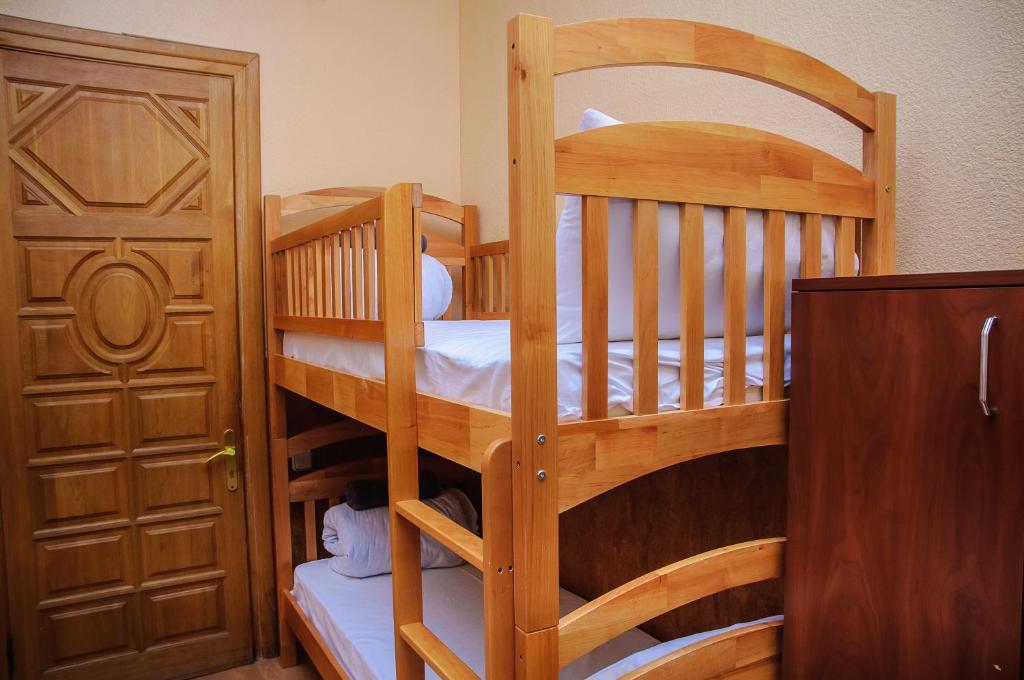 Postel nebo postele na pokoji v ubytování Golden Globus Hostel