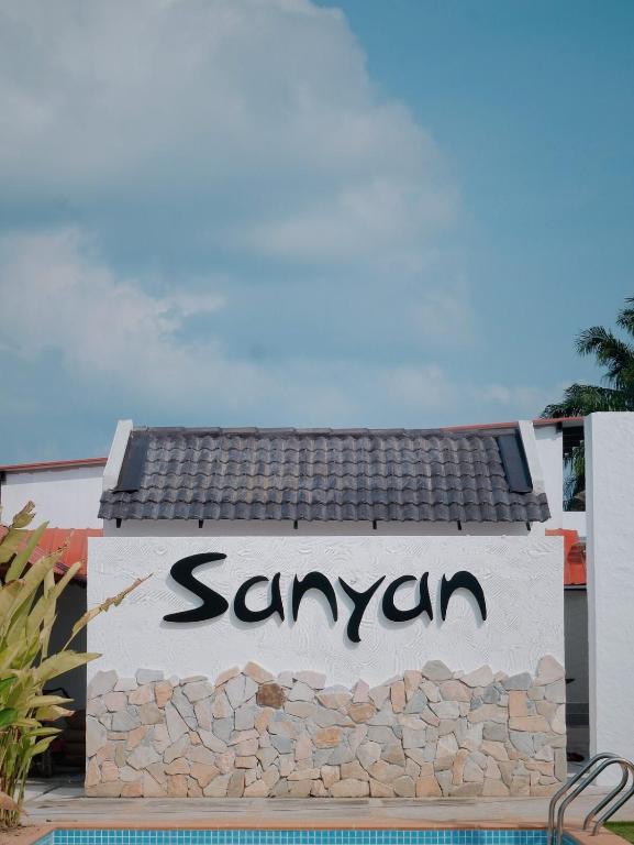 a sign for a sanyuan sign on a building at Sanyan Retreat in Jeram