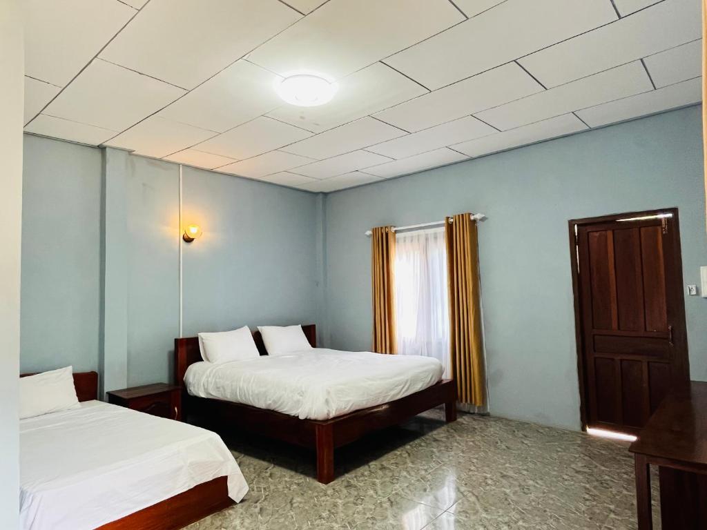 מיטה או מיטות בחדר ב-USV Resort