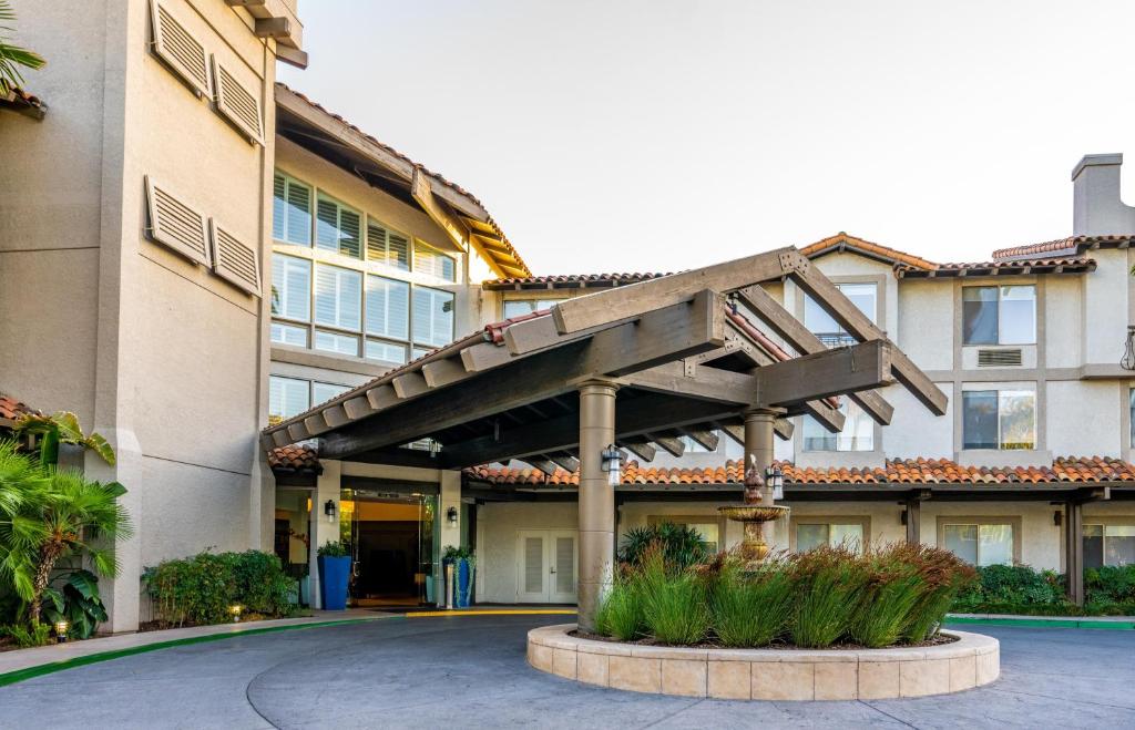 a building with a staircase in front of it at DoubleTree by Hilton Campbell - Pruneyard Plaza in Campbell