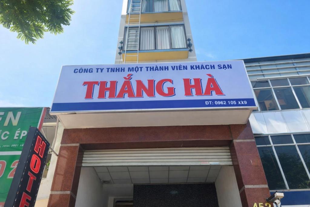 a sign that reads thing ha on top of a building at Thắng Hà Hotel in Ho Chi Minh City