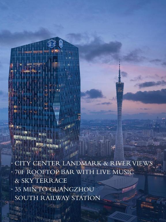 a city center landscape with a tall building and a tower at Park Hyatt Guangzhou in Guangzhou