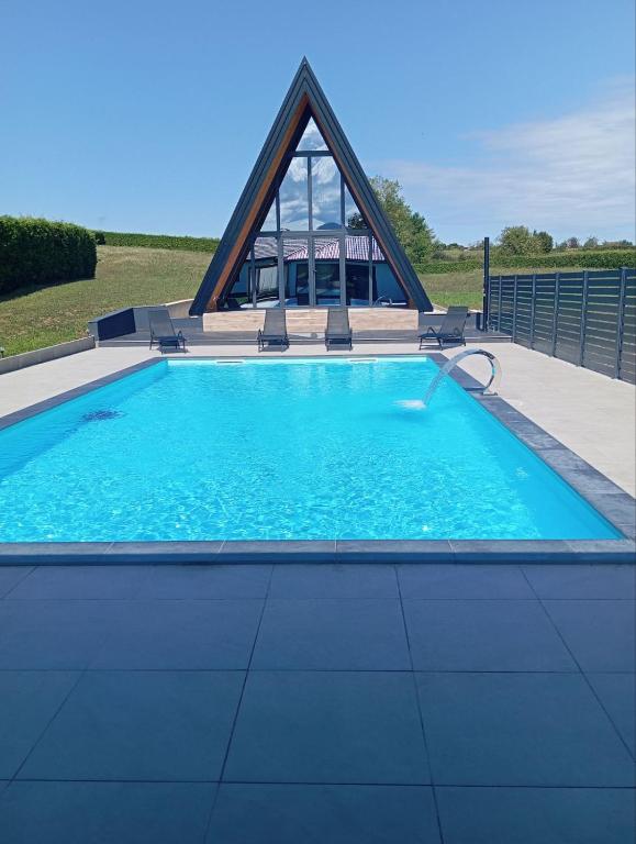 a large swimming pool with a pyramid shaped at Villa Rustic in Majetići