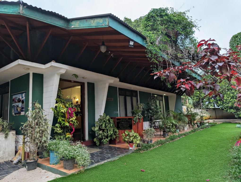 a house with plants in front of it at Prasada Resort in Badulla