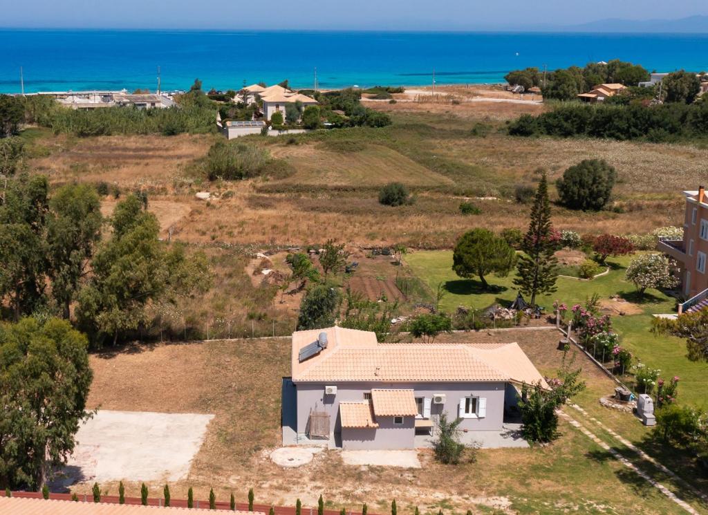 an aerial view of a house with the ocean in the background at Santa Marina House in Lefkada